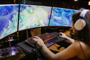 A Woman Playing League of Legends